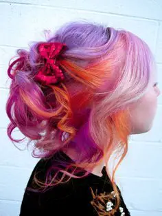 33-unique-split-hair-dye-ideas-trending-color-combinations-to-try-in-2023 Purple & Orange Split Hair