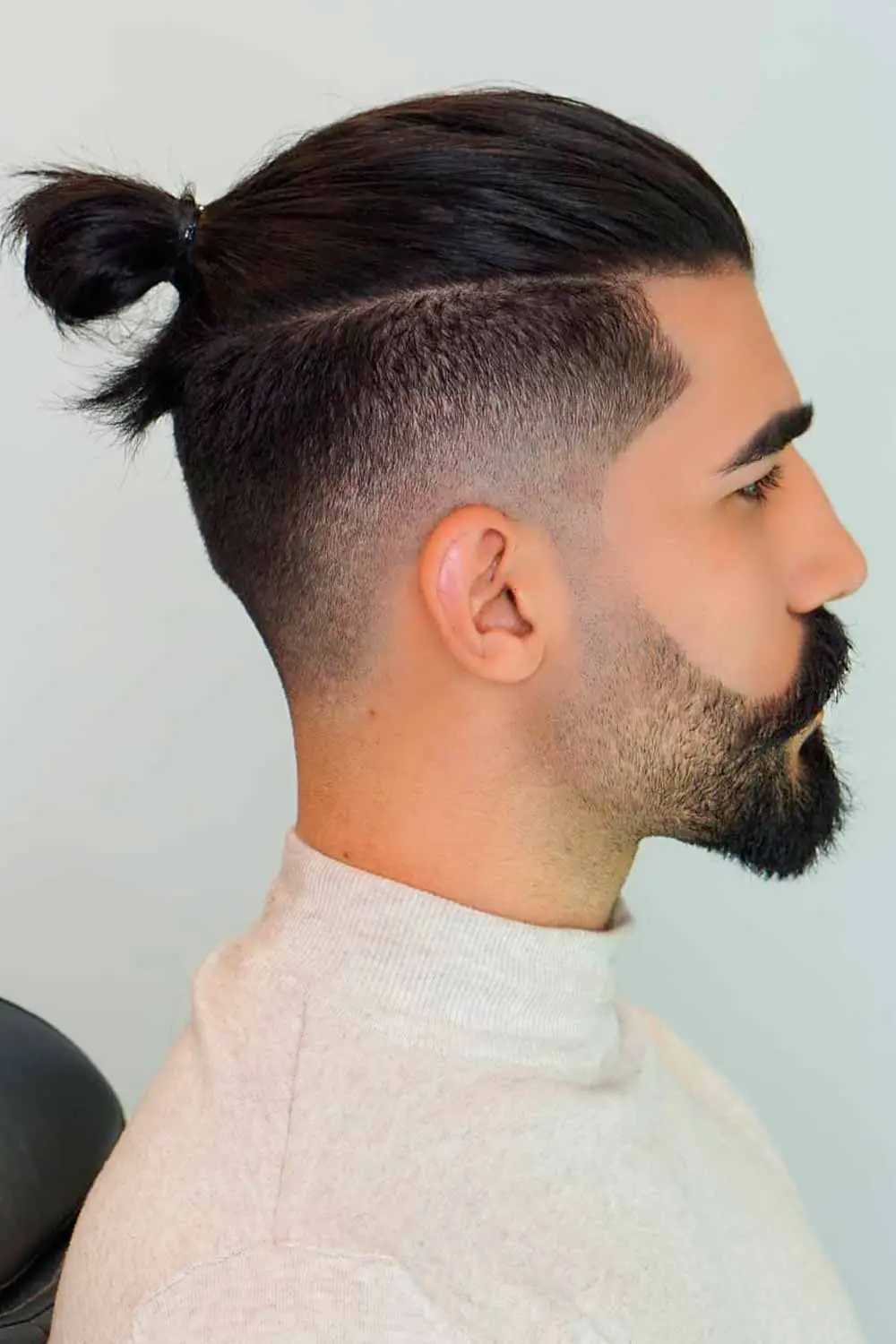 50-best-man-bun-hairstyles-trending-this-year Slick Back With Shaved Sides